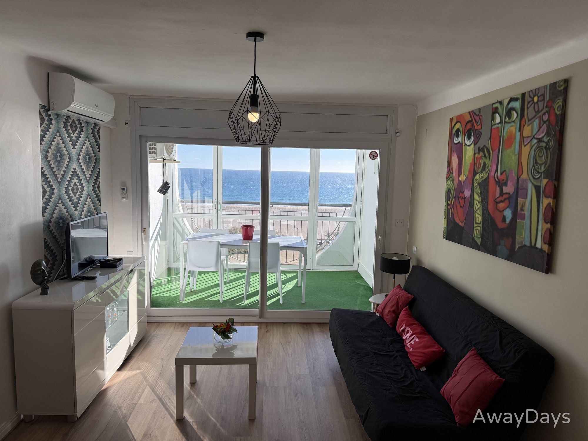 Salón acceso terraza con vista mar